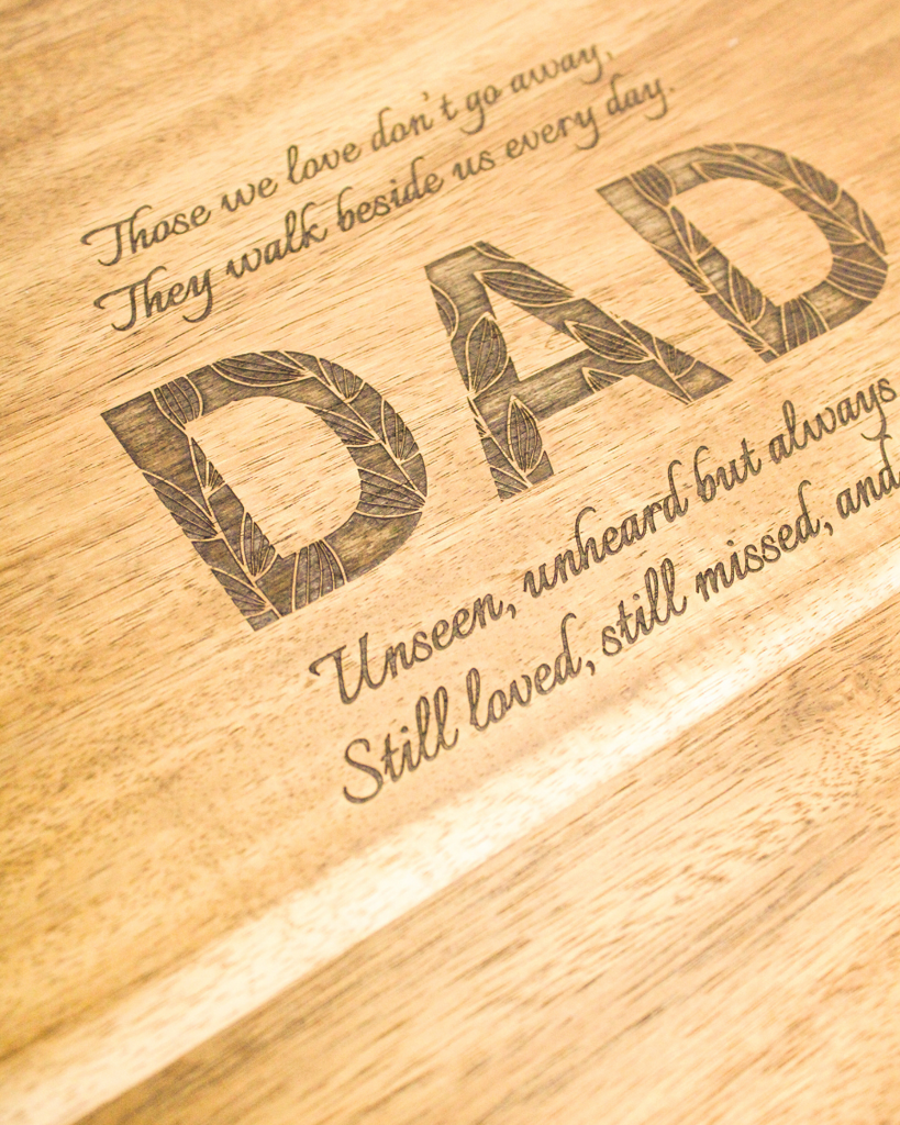 close up shot of an engraved keepsake box that says DAD