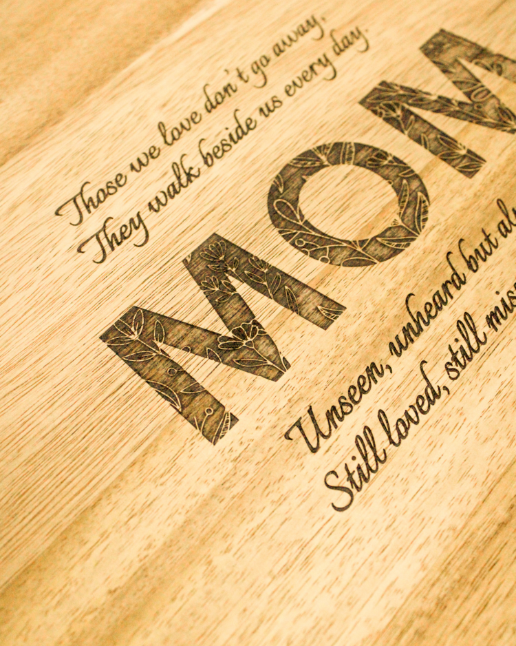 close up shot of an engraved acacia wood keepsake box