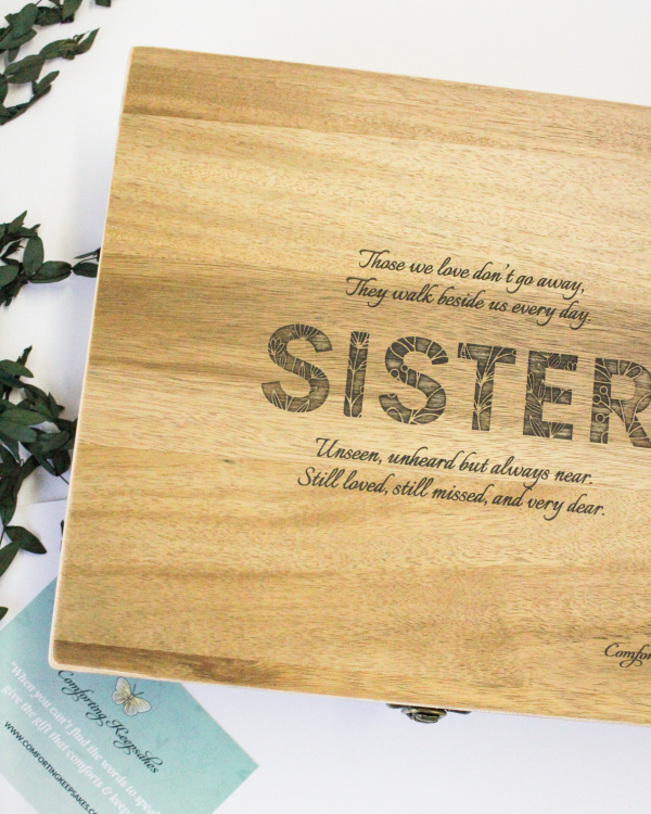 floral sister engraved box on a white background with a plant